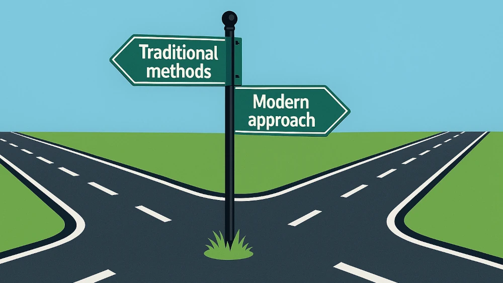 A directional road sign at a crossroads pointing left to Traditional methods and right to Modern approach against a blue sky and green landscape.